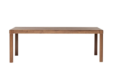 Gesamtansicht des BURLY Esstisches aus Massivholz mit klarem Fokus auf die Tischbeine