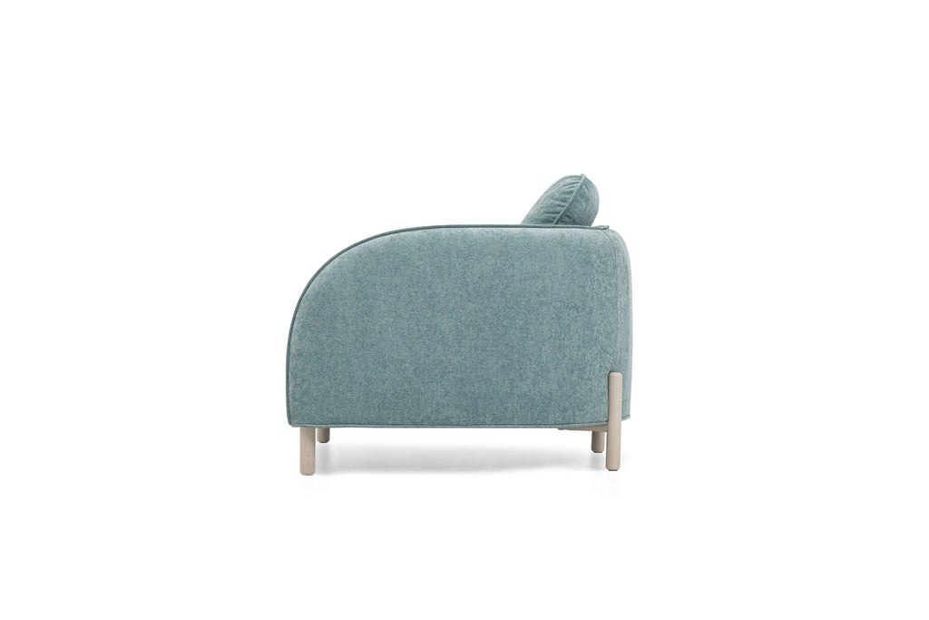 Sofa von EXTRAFORM in Seitenansicht mit gerundeter Armlehne