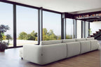 Designer Modular Sofa von Volumen in Rückansicht im modernen Wohnraum mit großen Glasfronten