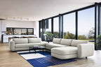 Designer Modular Sofa als großzügige Sitzgruppe mit Chaiselongue im lichtdurchfluteten Wohnbereich